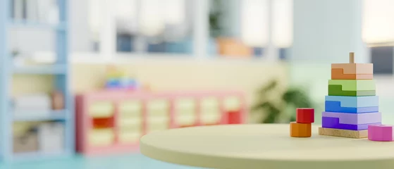 Foto op Canvas A round green table with colorful kid's toy in a colorful kid's playroom or kindergarten classroom. © bongkarn