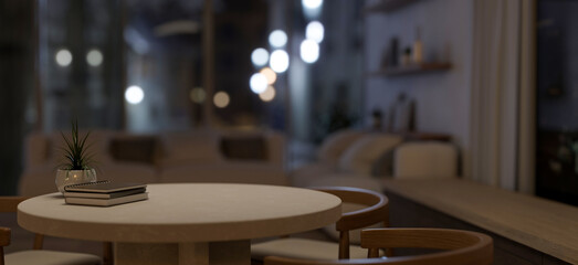 A space for displaying products on a round table in a contemporary and cozy living room at night.