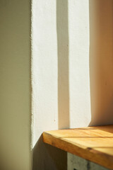Comfortable rest by the sunny window. A background with sunlight and shadows that can be used in various designs.