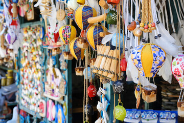 Turkish Handicrafts Displayed in Market Stall. A close-up display of traditional Turkish handicrafts including ceramics and dream catchers in a market stall