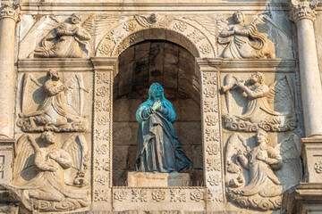 The statue and detail of the front wall of the Ruins of St. Paul's Macao, China.