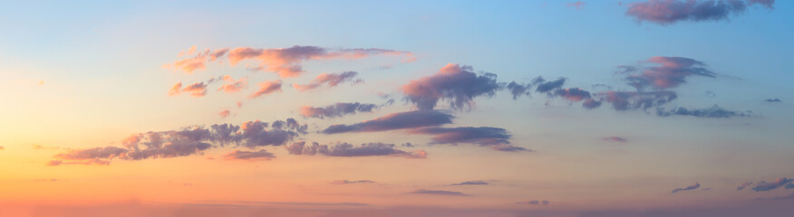 Real sunrise against the sky with pink colorful clouds. Without any birds. Large panoramic photo....