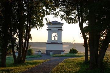 Early summer morning. Sunrise. Belarus. Novogrudsky region. White outlines of a historical kaplitsa...