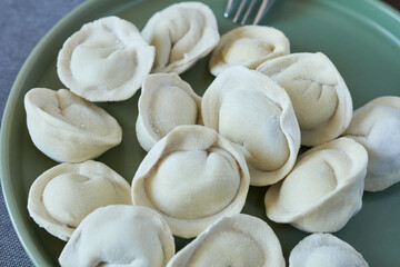 Fototapeta na wymiar Close-up of frozen dumplings, top view.