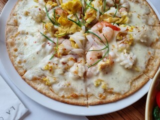 a pizza topped with seafood