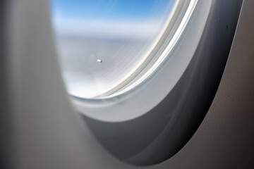 Part of an flying airplane window with triple glazing, close up