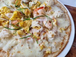 a pizza topped with seafood