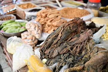 A close-up of Fucai, a Hakka pickled mustard green, at a market vegetable stall. Fucai is a staple...