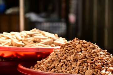 In Taiwan's markets, stalls display a variety of gluten products. Gluten, made from wheat flour, offers a chewy texture, a crucial element in Taiwan's vegetarian culture.