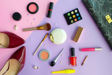 Top view Cosmetics, makeup brushes and eyeliners, fashion lipsticks for women makeup. facial beauty...