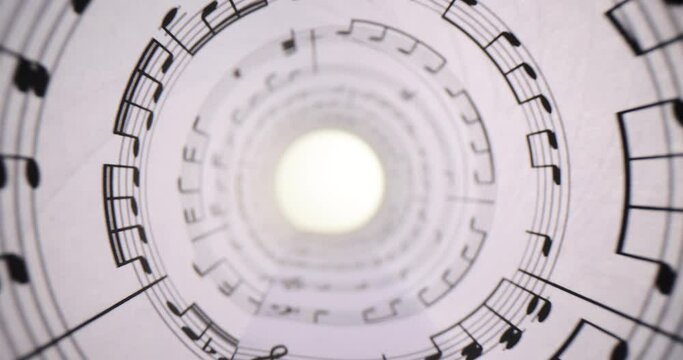 Rolled sheet of paper displays neatly printed musical notes