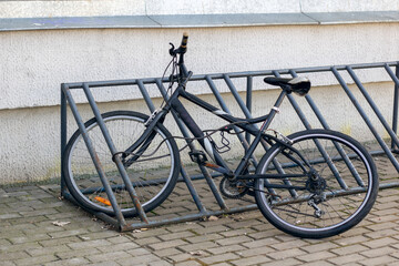 Fototapeta na wymiar Bicycle in the bicycle parking lot closeup