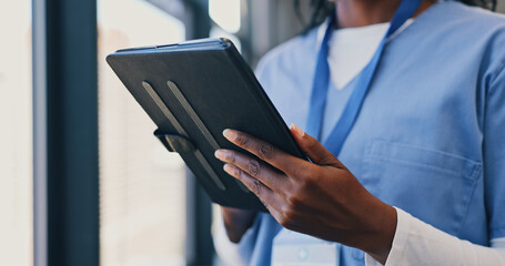 Hands, tablet and nurse in clinic for online consulting, telehealth or wellness on information...