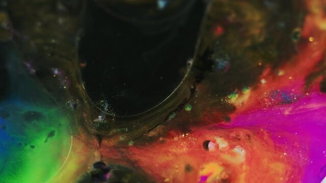 Paint water mix. Gel bubbles. Oil fluid. Blur pink blue orange green black color shiny particles ink flow motion abstract art background.
