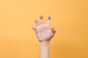 Roaring Hand Gesture Isolated on Yellow Background