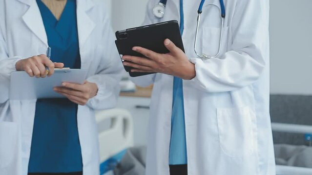 another member joining the team. Shot of two doctors shaking hands in a meeting at a hospital.