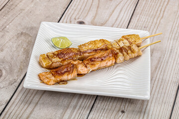 Grilled salmon skewer with sauce