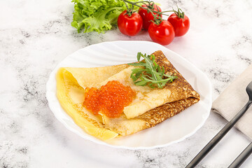 Russian pancake with red caviar