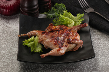 Grilled quail in the plate