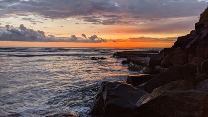 The Melted Rocks of Swamis Beach. Erosion control boulders put down along the shore 50 years ago...