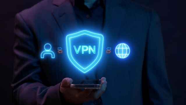 VPN, Virtual private network protocol concept. Businessman using smartphone to show glowing neon line animation of VPN icon on virtual screen for connect to VPN network.