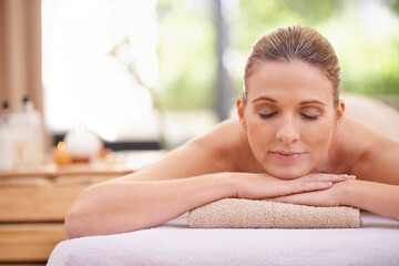 Girl, massage or relax at spa, wellness or holistic as peace, natural or therapy in self care. Woman, towel or zen in detox, balance or cosmetology at bodycare, clinic or retreat at luxury resort