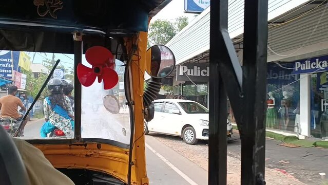 riding a rickshaw in india during the season