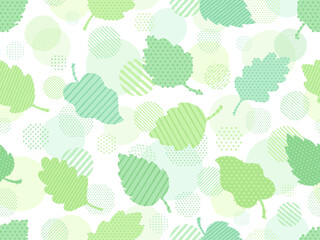 手描き風の緑の葉とドットとストライプ柄の円のパターン背景