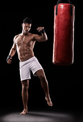 Kickboxing, man and workout in studio with punching bag for training, exercise or competition fight...