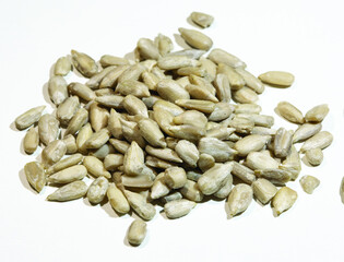Decorticated sunflower seeds on white