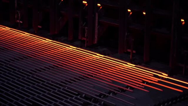 Mild steel in a steel mill. Steel production. Mechanized steel production.