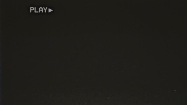 Rediscover the nostalgic charm of the 1980s with this vintage VHS tape overlay. Featuring analog TV noise and distortion, bad damage, long-lasting, loopable, has the text Play overlaid on top.