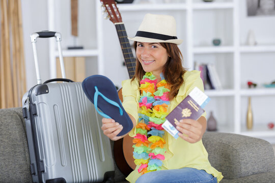 young woman traveler showing passport and ticket