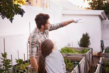 Father, daughter and gardening with pointing in home for bonding, happy family and curious child....