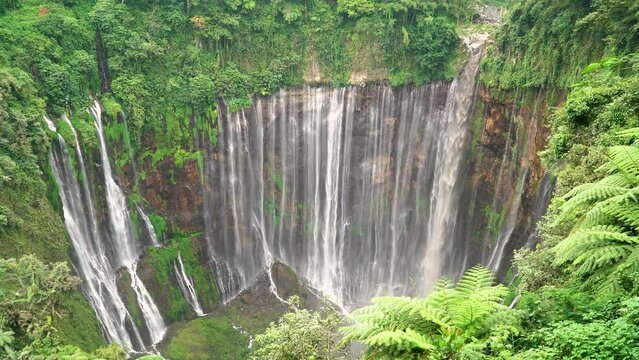 Tumpak Sewu the most beautiful waterfall in Indonesia with Semeru volcano in the background. Java Island