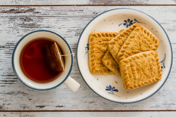 Assortment of Biscuits on a Plate, Served with a Cup of Tea