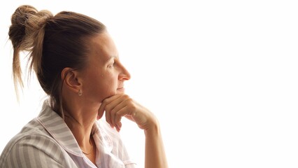 Woman gazes thoughtfully out of window pondering world beyond Lost in contemplation she stars into...