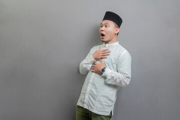 Asian muslim man with shocked facial expression