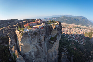 High aerial drone view of Monastery of the Holy Trinity (Agia Triada) in Meteora, Greece. A UNESCO...