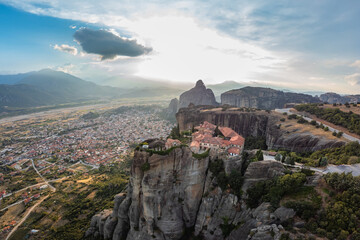 High aerial drone view of Monastery of Saint Stephen (Agios Stefanos Monastery) in Meteora, Greece. St. Steven Monastery, a UNESCO World Heritage site.