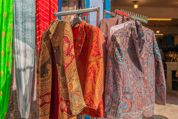 Traditional Rajasthan dress hanging at the street at a shop in Jodhpur, India.