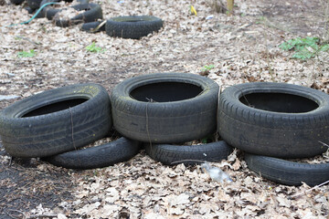 the remains of rubber tires in an old dirty dump