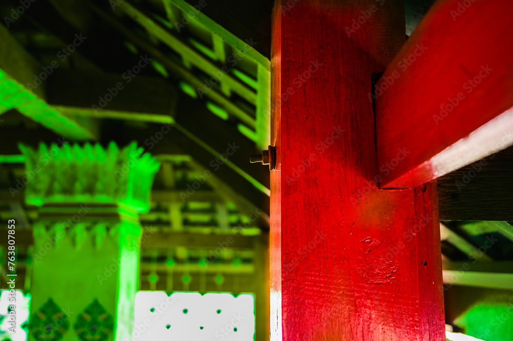 Wall mural Red column and beam at a temple in Nakhon Sawan Province.