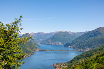 Fototapeta na wymiar Aerail View over Lugano with Alpine Lake and Mountain in a Sunny Day in Ticino, Switzerland.