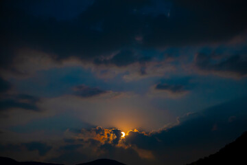 Moonlight in Cloudscape at Night in Lugano, Ticino, Switzerland.