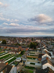 Fototapeta premium Aerial View of Residential Homes During Orange Sunset over England UK