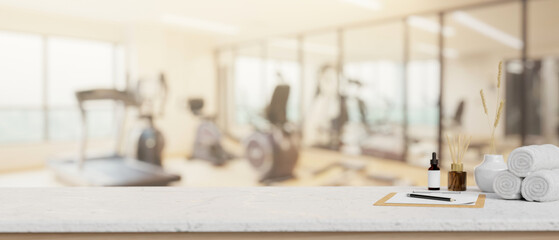 A space for displaying products on a tabletop with a blurred background of a modern fitness center.