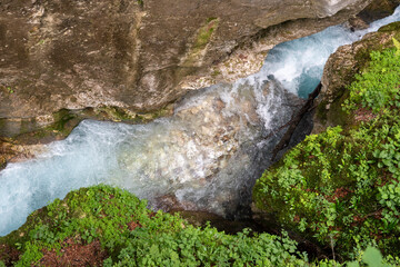 A closeup view from above of a gorge with clear water. - 763821832