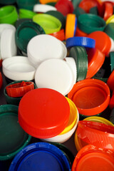 Close up of red, white, blue, yellow and green caps from plastic bottles. plastic collection. copy space