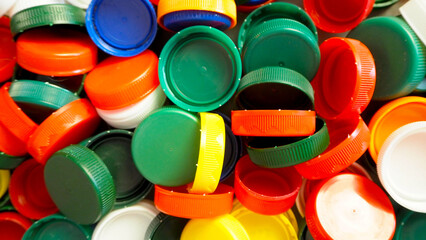 Close up of red, white, blue, yellow and green caps from plastic bottles. plastic collection. copy...